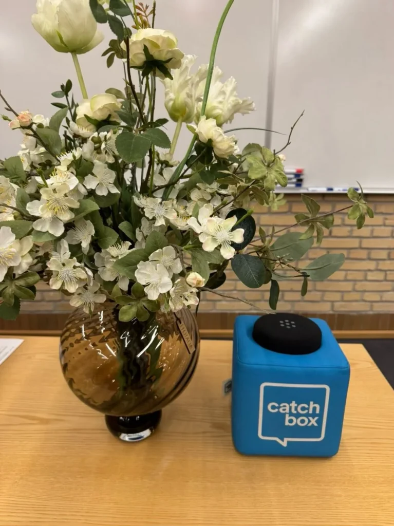 Conference flowers and a Catchbox microphone at the sleep and circadian rhythms symposium in Aarhus